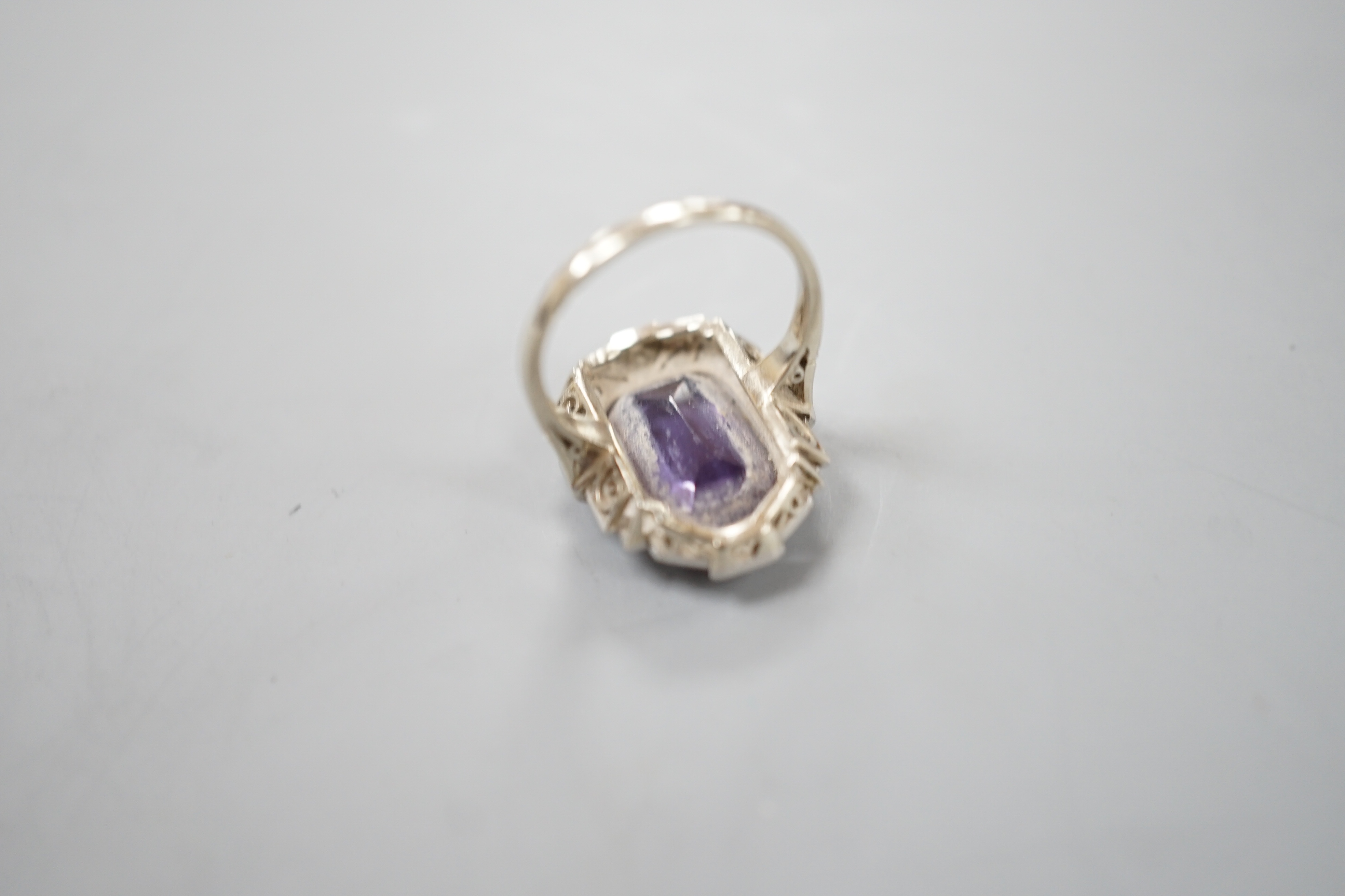 An Art Deco style white metal, synthetic colour change corundum and diamond chip set dress ring, size L/M, gross weight 5.6 grams.